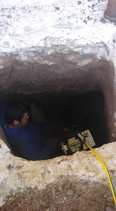 Sometimes to get down beneath the foundation, it puts us in tight spaces. This image shows our crew drilling down beneath the foundation to install our hydraulic lifts and begin the process of lifting the home. We are gentle during this process and careful to watch for any unusual displacement. 