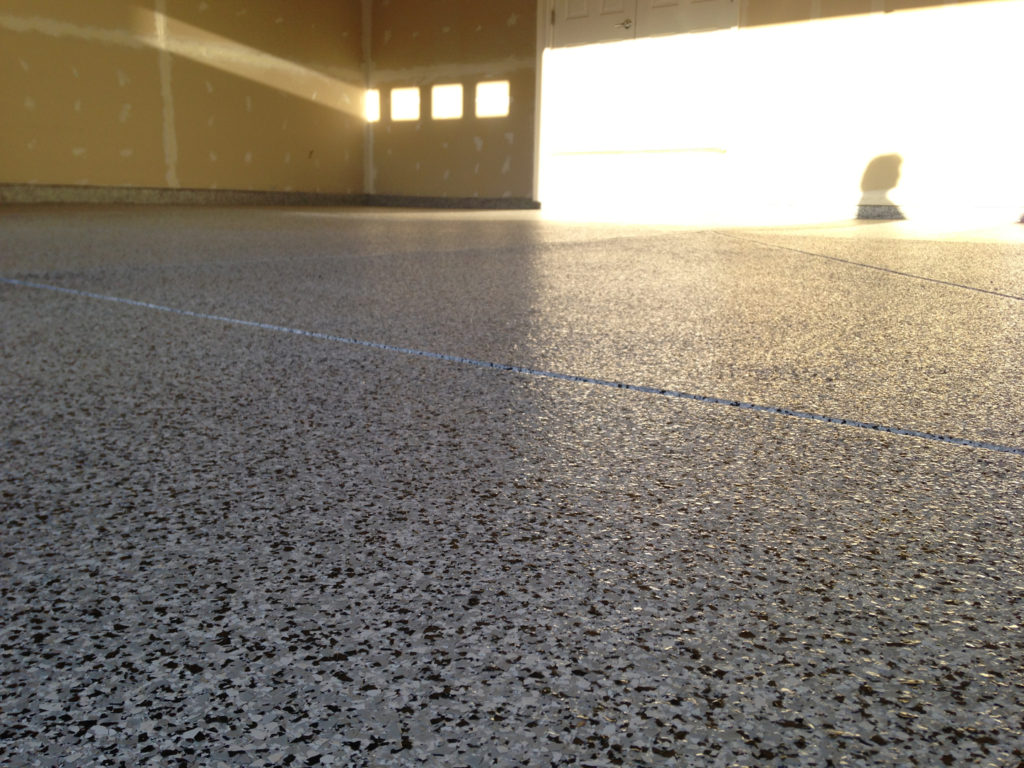 We love the adaptability of our One Day Coatings product line. It is perfect for all types of applications and can lasts in the harshest types of environments. This image shows another Vinyl Chip System installed in a garage. This is perfect for home owners who want to boost the value of their home while making their garage space safer and look a whole lot better!