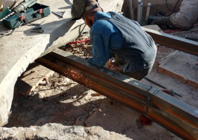 To create a serviceable area below our deck, we needed to install several I-Beams to support our decking. We excavated below our deck & removed the old material. At this point, we installed our I-Beams by welding and cutting them to shape. These were supported by hydraulic rams that are now permanently installed below our decking. This gives us complete access below our deck to access our plumbing and make repairs in the event of a breakage. Talk about some cost saving measures! This saves our customer from having to remove sections of decking to complete a repair for future events.