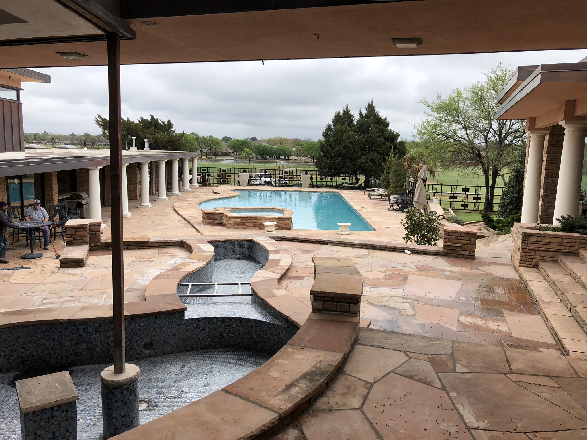 Here is one last look at this gorgeous backyard setting. As you can see from this image, there are going to be two elevated water features that run down to our pool. These water features will not be connected, but instead will have a catch basin and run on their own closed plumbing loop.