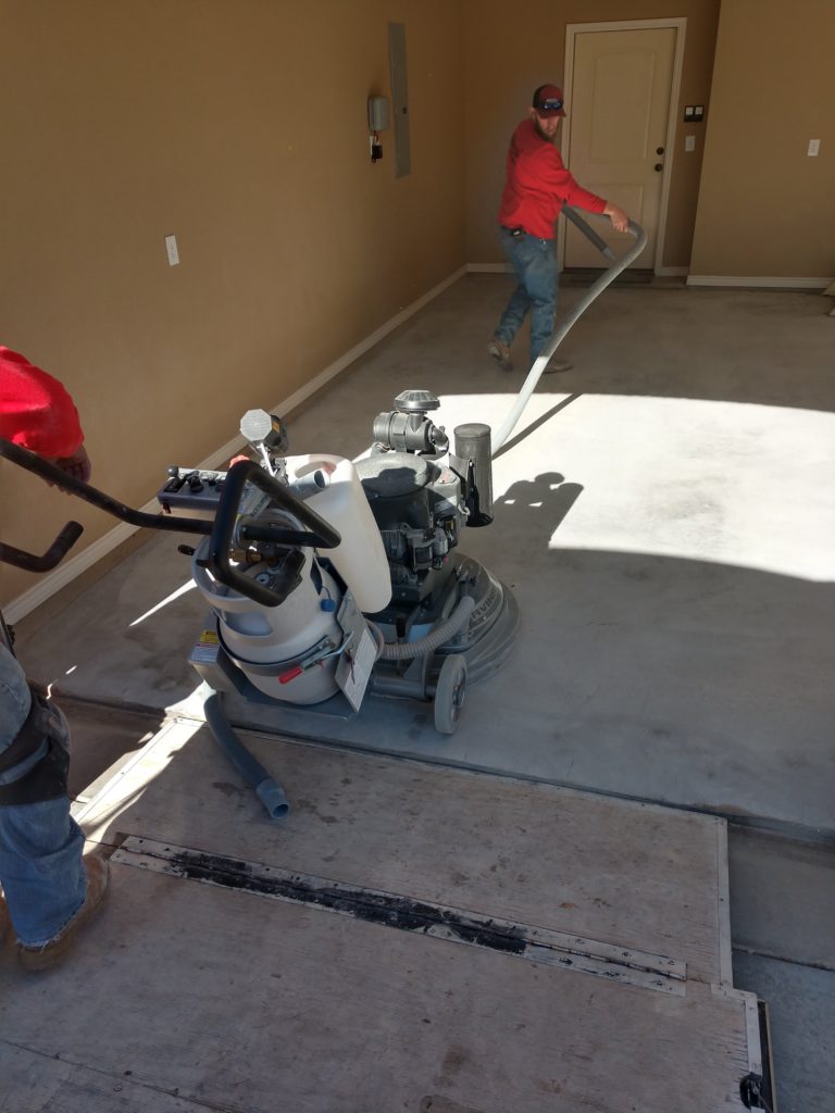 We use some commercial sanding & buffing equipment to purge our garage floor of dust and debris. This removes our top layer of concrete to expose a fresh layer that we use to apply our Polyurea bond coat. Preparing our floor is the most crucial part of the 1 Day Coatings process and is the stage where we spend most of our time. This must be done correctly to ensure proper bonding between our Vinyl Chip system and your garage floor.