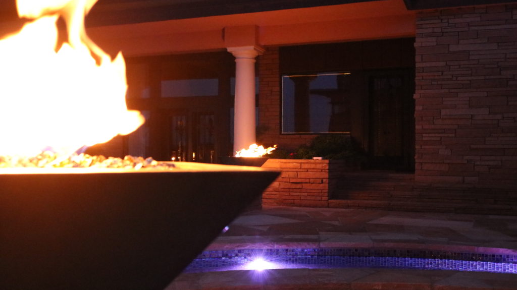This image shows our two Maya Fire Bowls that we custom designed with a copper patina finish! This project is entirely 100% custom and showcases our ability to create any backyard landscape that you can imagine. These fire pits can be controlled from a wireless handheld controller by our amazing Smart Controller technology! 