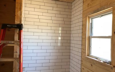Part of our job involves building a beautiful bath tub & shower with classic white subway tiles. Here you can see we've installed the tile and are allowing the thin-set to dry & bond the tile to the wall.