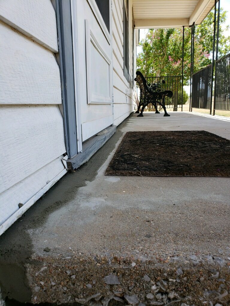 Alas, now that we've elevated this home back to level and patched it with new concrete, the effect of the foundation shifts is nearly invisible (aside from the wet concrete). Our client now has a foundation that is protects their home and property value. 