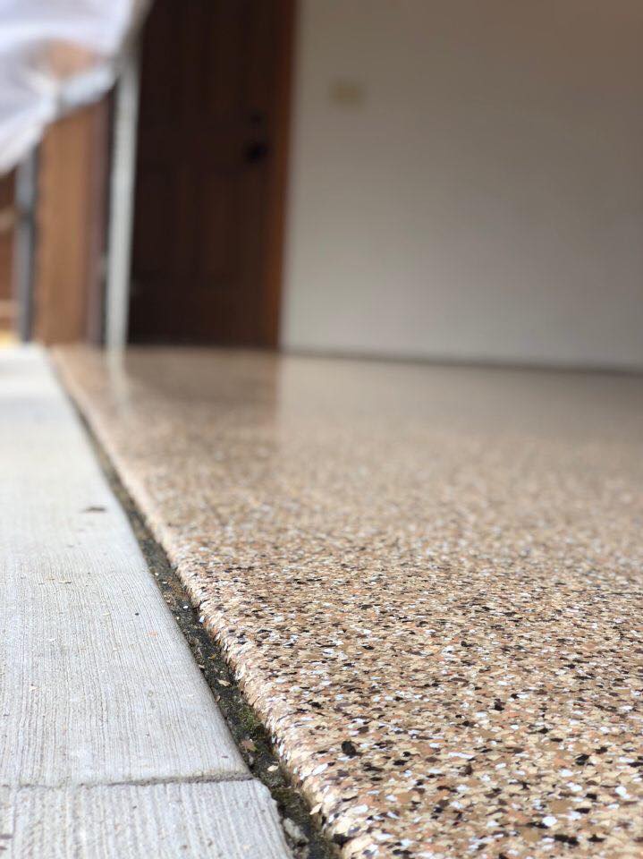Our teams take great care to ensure we create a seamless transition from our 1 Day Coatings product to your drive way. This image illustrates the beautiful edge work that we can do with our industrial floor coatings. Beautiful!